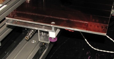 Thumb screw for leveling print bed.   Screw is threaded into teflon block.