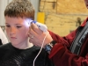 mini_maker_fair___microscope_with_kid_looking_at_hair